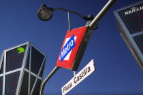 City centre metro sign  Plaza Castilla  beneath the Torres Puerta Europa. Underground train station.LogoTourismHolidaysTravelCenter