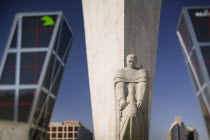 Detail of Espana A Calvo Sotelo statue in front of the Torres de Europa in Plaza de Castilla.IconTravelTourismHolidaysSkyscrapersModern Architecture