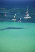 Wind surfing at Platja des Pujols  Formentera.  SunshineBeachHolidaysTourism