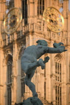 Detail of the Brabo Fountain in Grote Markt  Main Square with Onze Lieve Vrouwkathedral  Cathedral of Our Lady behind.HolidaysTravelTourism