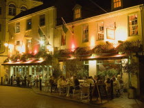 Donatello Italian restaurant at night in Brighton Place in The Lanes withy people dining at tables on the pavement