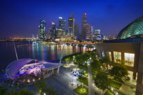 City view at dusk from the roof top promenade ofEsplanade. Theatres on the BaytwilightskyscraperskylinearchitecturetravelAsiaSingaporeAsian Singaporean Singapura Southeast Asia Xinjiapo