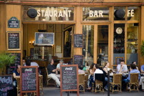 Montmartre People at tables on the pavement outside a cafe in the Rue Yvonne le TacFrench Western Europe European