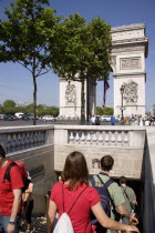 Tourists entering the pedestrian tunnel under the Place de Charles de Gaullle leading to the Arc de TriompheFrench Western Europe European