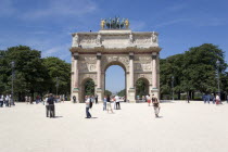 Tourists around the Arc de Triomphe du Carrousel at the eastern entrance to the Jardin des TuileriesFrench Western Europe European