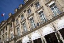 The Ritz Hotel in Place Vendome with the French Tricolour flying from a flagpole above the Ministry of Justice next doorFrench Western Europe European