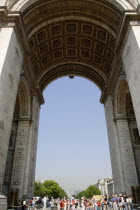 Tourists around the Tomb of The Unknown Soldier under the central arch of the Arc de Triomphe in Place de Charles De GaulleFrench Western Europe European