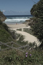 Couple walking in Secret CoveMoreton bay Antipodean Aussie Australian Oceania Oz