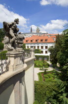 The Vrtba Gardens in the Little Quarter with St Vituss Cathedral in Prague Castle beyond. Statues of Classical Gods by the Artist Matthias Braun in the foregroundPraha Ceska Eastern Europe European R...