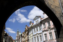 Renaissance and Baroque houses in Bridge Street in the Little Quarter seen through the arch of the Little Quarter Bridge TowerPraha Ceska Eastern Europe European