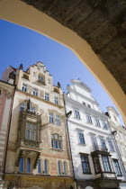 The Two houses named The Storch House and At The Stone Ram seen through an arch in the Old Town SquarePraha Ceska Eastern Europe European Religion