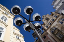 Lamp post in the Old Town Square in front of the Storch House with its wall painting of St Wenceslas on horseback by artist Mikulas AlesPraha Ceska Eastern Europe European Religion