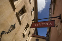 Via Musica shop sign hanging above a narrow street in The Old TownPraha Ceska Eastern Europe European Store