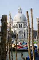 The Baroque church of Santa Maria della Salute in the Dorsoduro district with Gondolas on the Grand Canal in front of it