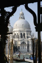 The Baroque church of Santa Maria della Salute with gondolas and water taxis on the Grand Canal