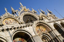 The four bronze Horses of St Mark on the facade of the basilica above the Central Doorway and its 17th Century mosaics