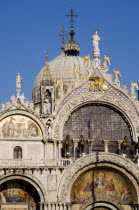 The four bronze Horses of St Mark on the facade of the basilica above the Central Doorway and its 17th Century mosaics