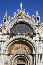 The four bronze Horses of St Mark on the facade of the basilica above the Central Doorway and its 17th Century mosaics