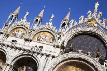 The four bronze Horses of St Mark on the facade of the basilica surrounded by 17th Century mosaics