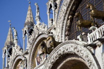 The four bronze Horses of St Mark on the facade of the basilica surrounded by 17th Century mosaics