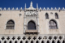 The 1536 balcony on the west facade of the Doges Palace with a carving of the Doge kneeling before the Lion of St Mark