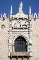 The 1536 balcony on the west facade of the Doges Palace with a carving of the Doge kneeling before the Lion of St Mark  the symbol of Venice