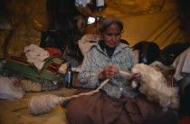 Navajo Indian woman spinning wool in home.American Mexican North America United States of America