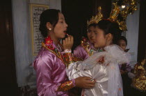 Funeral dancers putting on make up at the funeral for an Abbot at the Endawya Paya Monastery. Burma Asian Burmese Myanma Myanmar Southeast Asia  Burma Asian Burmese Myanma Myanmar Southeast Asia