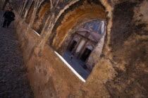 Arches and a church with a woman and a boy.Kids Mexican Religion Hispanic Latin America Latino Religious Kids Mexican Religion Hispanic Latin America Latino Religious