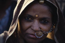 Portrait of woman wearing nose to ear jewellery.Asia Asian Bharat Inde Indian Intiya Jewelry  Asia Asian Bharat Inde Indian Intiya Jewelry