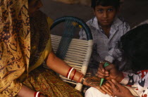 Applying henna to hands in preparation for wedding.Asia Asian Bharat Inde Indian Intiya Marriage Religion Religious Asia Asian Bharat Inde Indian Intiya Marriage Religion Religious