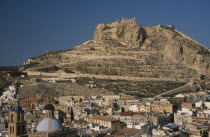 Alicante.  Castle on top of steep  rocky hillside with city spread out below.Espainia Espana Espanha Espanya European Hispanic History Southern Europe Spanish