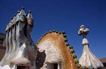 Passeig de Gracia  Casa Batllo  Ornate chimneys  Dragons back roof and Saint George cross. GaudiTravelTourismHolidayVacationExploreRecreationLeisureSightseeingAttractionTouristTourCasaBat...