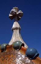 Passeig de Gracia  Casa Batllo  Dragons back roof and Saint George cross. GaudiTravelTourismHolidayVacationExploreRecreationLeisureSightseeingAttractionTouristTourCasaBatlloBarcelonaSpa...