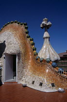 Passeig de Gracia  Dragons back roof and Saint George cross  Casa Batllo. GaudiTravelTourismHolidayVacationExploreRecreationLeisureSightseeingAttractionTouristTourCasaBatlloBarcelonaSpa...