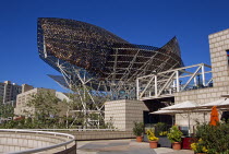 Port Olimpic  Frank Gehrys bronze fish sculpture.TravelTourismHolidayVacationExploreRecreationLeisureSightseeingTouristAttractionTourPortOlimpicBarcelonaSpainSpanishEuropeEuropeanUn...