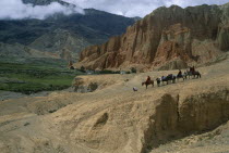 High ranking Tibetan lama and attending monks leaving Drakhmar on horseback.Asia Asian Nepalese Religion Religious