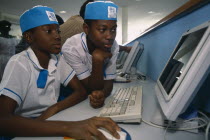 Two children in uniform working on a computer at the British CouncilAfrican Kids Learning Lessons Nigerian Teaching Western Africa 2