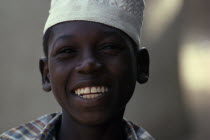 Head and shoulders portrait of smiling Islamic boyAfrican Happy Kids Nigerian Religious Western Africa Contented Religion One individual Solo Lone Solitary