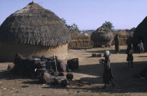 Village of thatched circular mud hutsAfrican Nigerian Western Africa