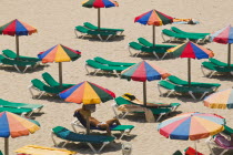 Eivissa. Parasols and sunbeds on the beach.TourismHolidaysMediterraneanBalearic IslandsTravelLeisureSpainEuropeSeasideColourRelaxPatternParasolBeaches Color Espainia Espana Espanha Espan...