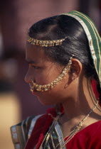 Portrait side profile of a girl wearing traditional dress and jewellery before the start of the Shekhawati FestivalAsia Asian Nepalese Bharat Inde Indian Intiya Male Men Guy Male Man Guy Religion Rel...