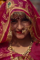 Head and shoulders portrait of a female dancer in traditional dress before the start of the Shekhawati FestivalAsia Asian Nepalese Bharat Inde Indian Intiya Male Men Guy Male Man Guy Religion Religio...