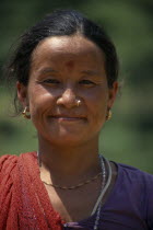 Head and shoulders portrait of woman wearing nose ring smiling in Baloti Village Asia Asian Nepalese Female Women Girl Lady Female Woman Girl Lady Happy Contented One individual Solo Lone Solitary