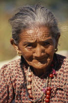 Portrait of elderly woman in Kharang Village near the Arun River ValleyAsia Asian Nepalese Female Women Girl Lady Old Senior Aged Female Woman Girl Lady One individual Solo Lone Solitary