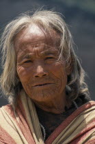 Head and shoulders portrait of elderly woman in Gomba VillageAsia Asian Nepalese Female Women Girl Lady Old Senior Aged Female Woman Girl Lady One individual Solo Lone Solitary