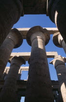 Temple Of Amun. Coloumns in the Great Hypostyle Hall. Angled view looking up through coloumns towards blue sky African Middle East North Africa History