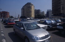 Busy road with traffic and tall buildings behindAfrican Middle East North Africa