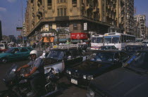 Busy road with traffic including buses  taxis and motorbikesAfrican Middle East North Africa