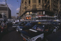 Busy road with traffic including buses  taxis and motorbikesAfrican Middle East North Africa